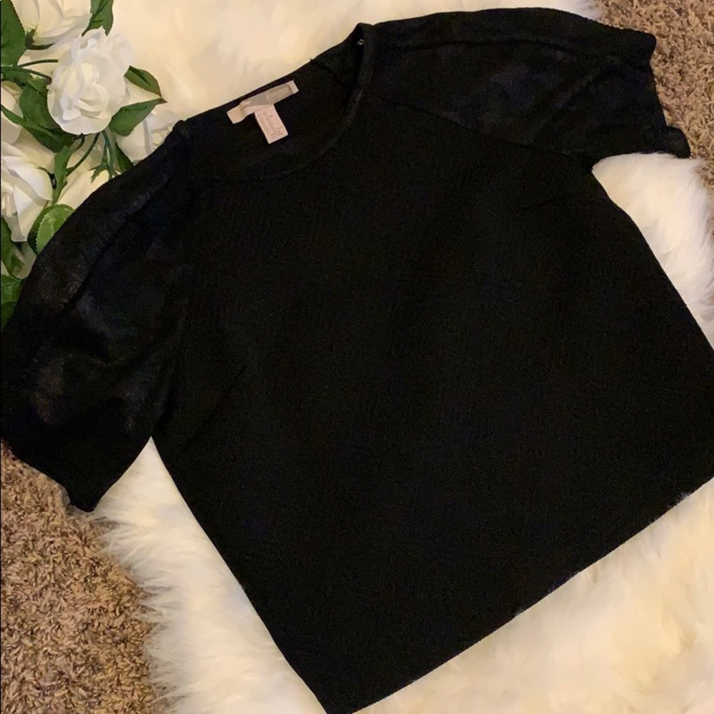 Classy top with detail front and leather sleeves!